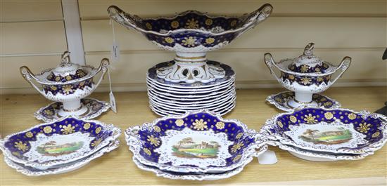A Staffordshire dessert service, decorated in cobalt blue and gilt and painted topographical scenes